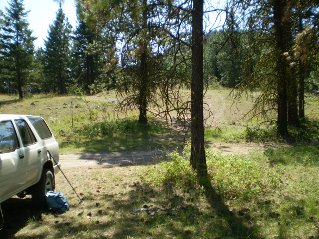 Parked in the clearing, trail can be seen across the road, Mount Eneas 2011-08.